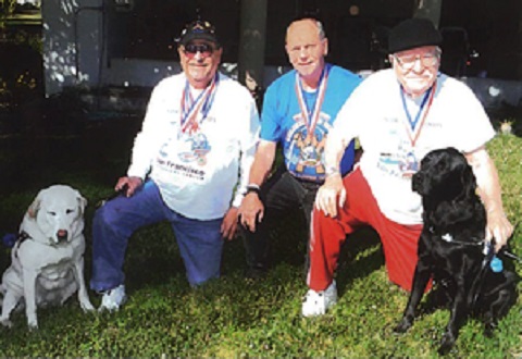 From Left: Guide dog “Thorn” with Veteran Ray Trevino, Veteran Don Pecsenye, and Veteran Don Smith with his guide dog, 
