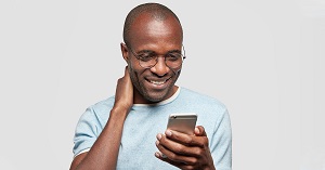 Veteran looking at a phone