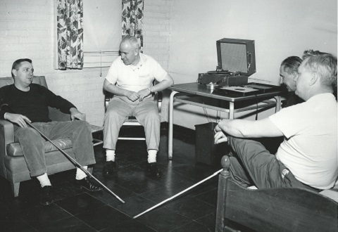 Patients in the recreation room after hours socializing at the first Blind Rehabilitation Center, Hines VA Hospital in Chicago.